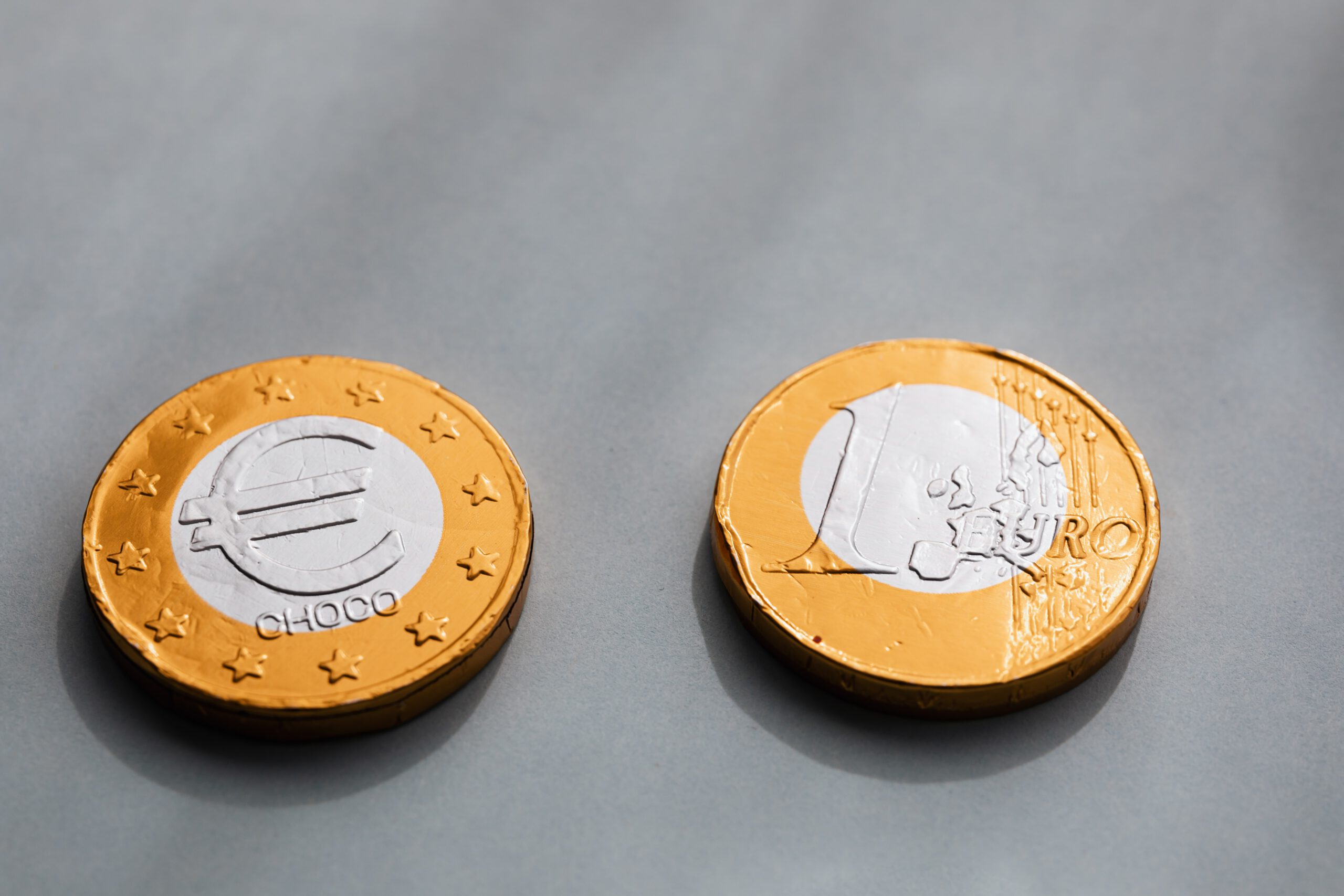 coins-one-euros-lying-on-gray-table-4040859